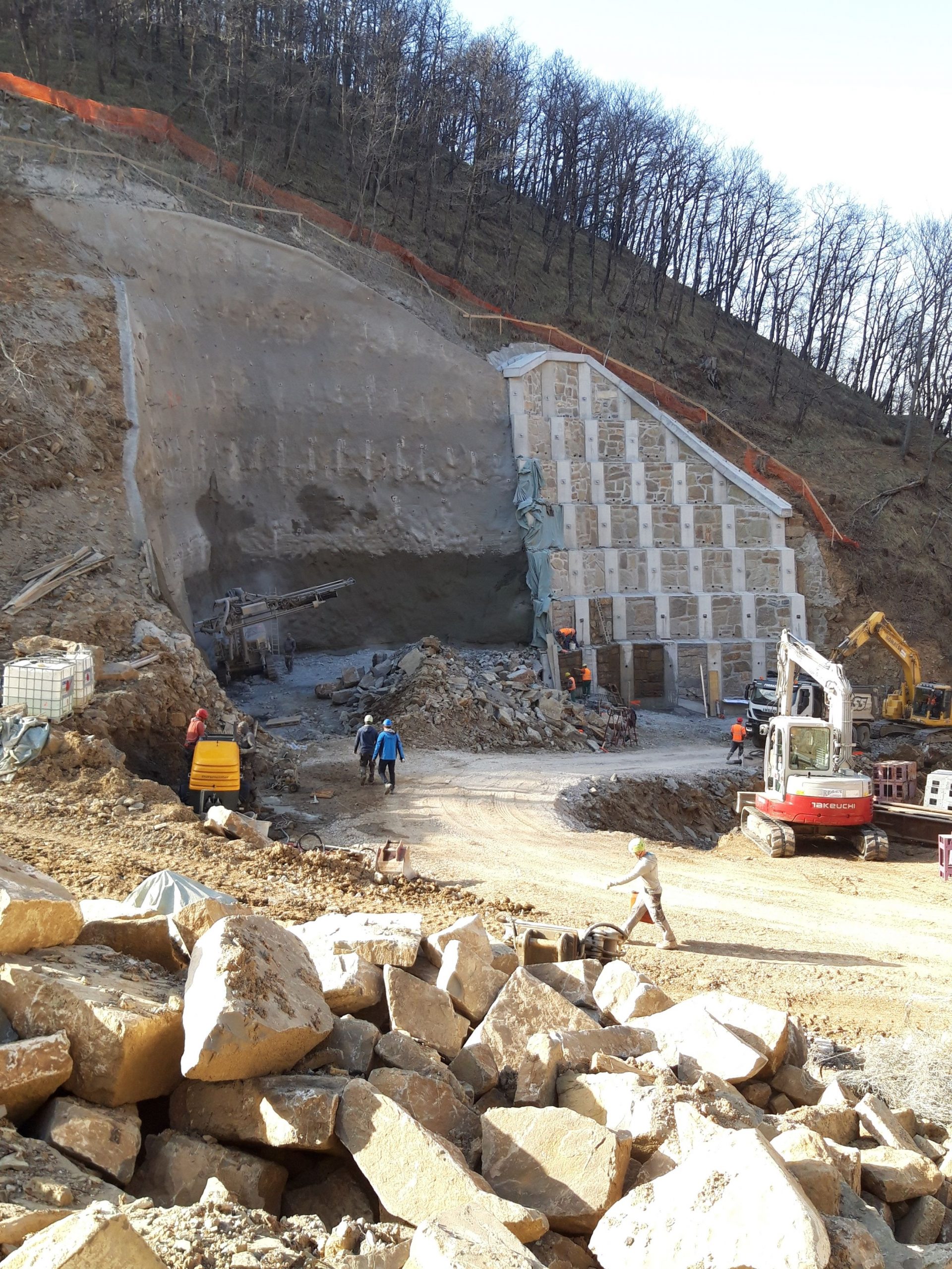 Construction site with workers and heavy machinery
